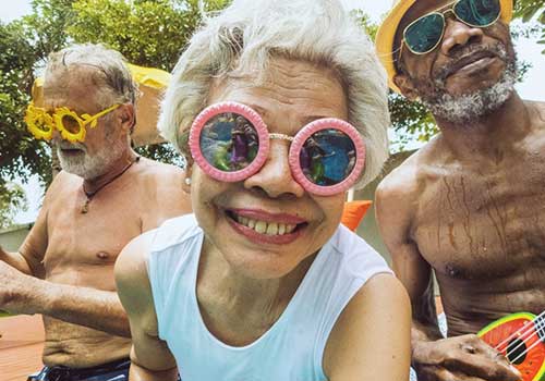 Friends in sunglasses smiling at camera